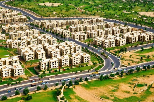 Explore how urban expansion affects rural real estate in Pakistan with insights into developments like Faisal Town Phase 2 shaping the landscape.